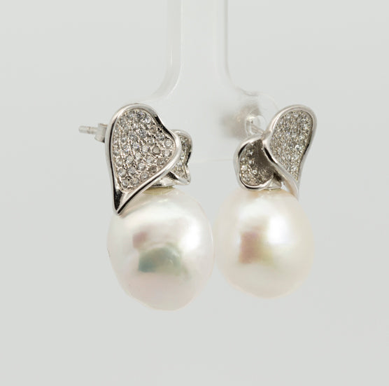 Pearl earrings, flower-shaped, adorned with white zircons